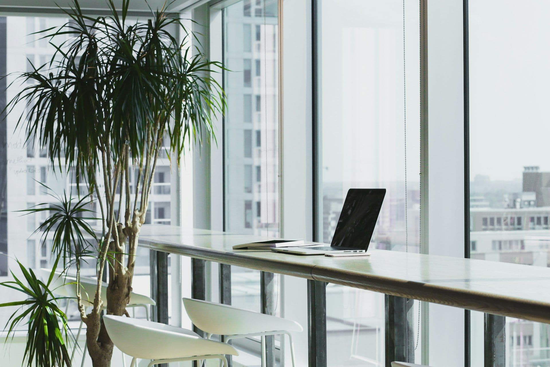 [syncsoft-auto][src:unsplash|id:1497215728101-856f4ea42174] Modern corporate office overlooking a city skyline representing intelligent process outsourcing and the BPO to IPO transformation in 2026