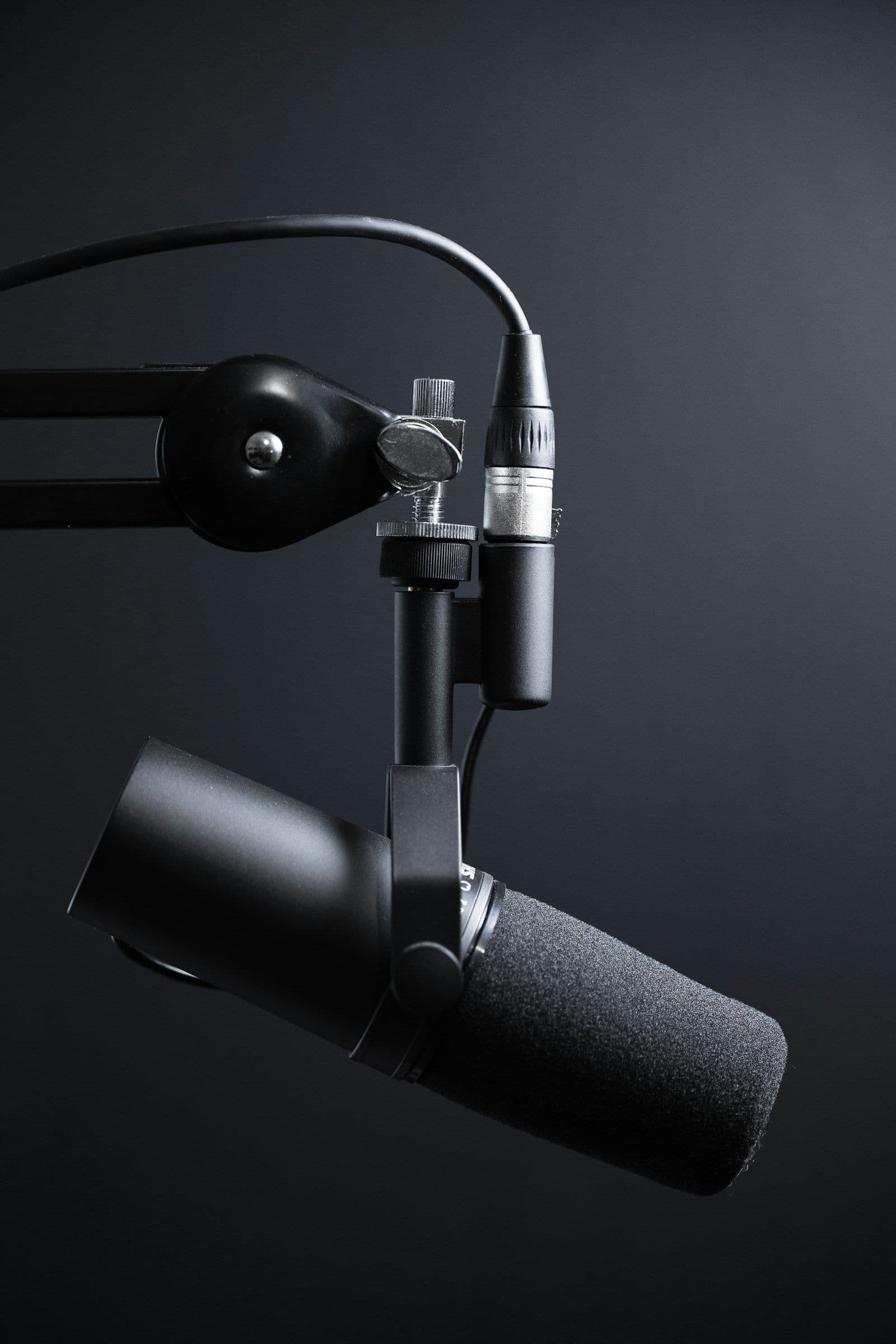 [syncsoft-auto][src:unsplash|id:1590602847861-f357a9332bbc] Voice AI agents production stack microphone studio illustration showing real-time speech interface for sub-300ms enterprise deployments