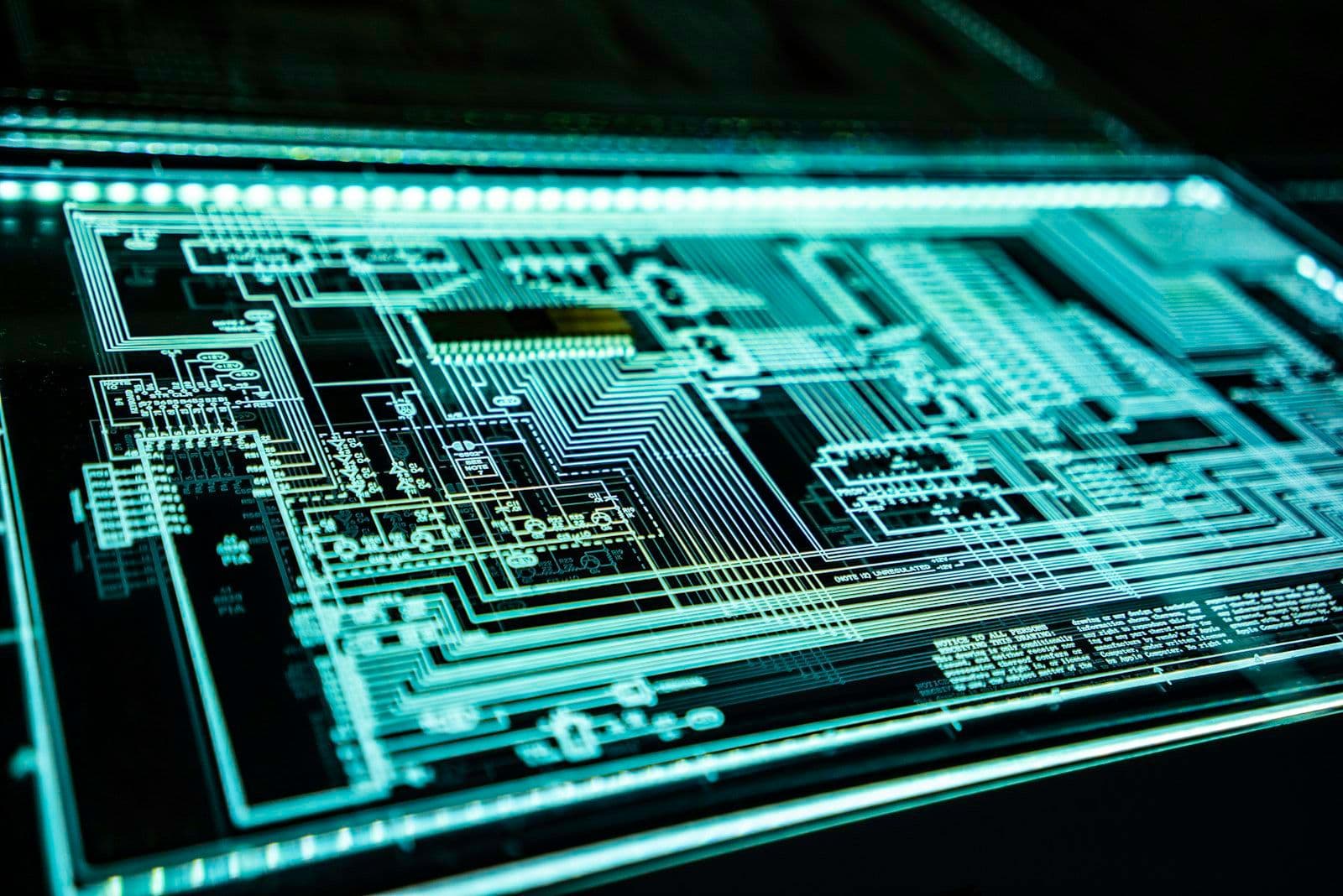 [syncsoft-auto][src:unsplash|id:1550751827-4bd374c3f58b] AI agent security circuit board visual showing layered defenses against prompt injection for enterprise agentic systems in 2026
