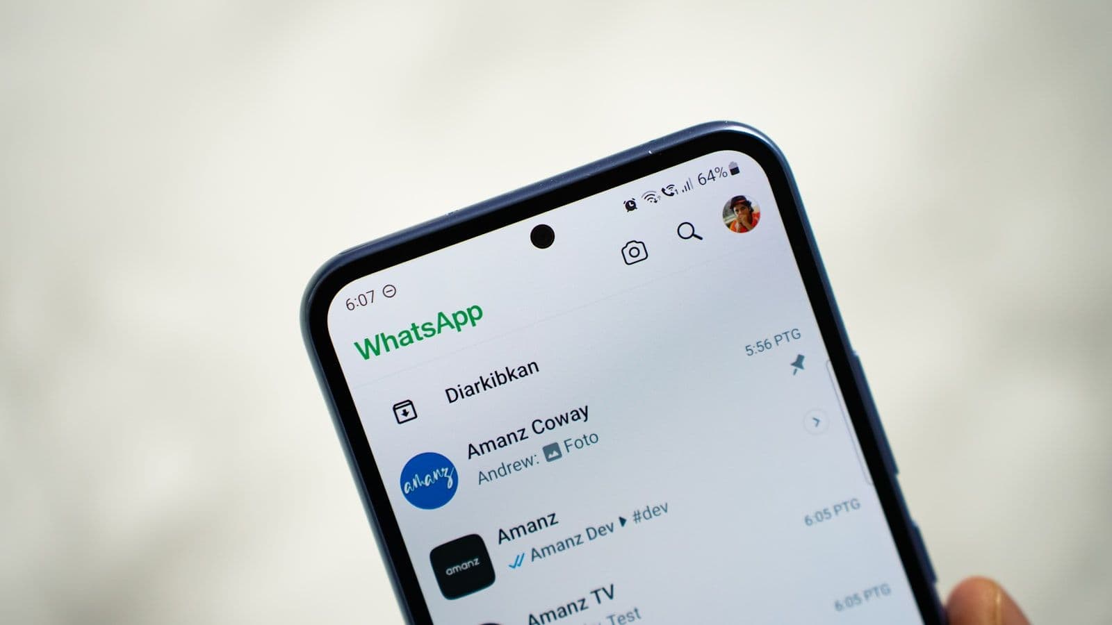 [syncsoft-auto][src:unsplash|id:1719204718581-5c95889c8ec9] Person using WhatsApp messaging on a smartphone illustrating the Meta Business Agent conversational AI platform for enterprise customer service in 2026