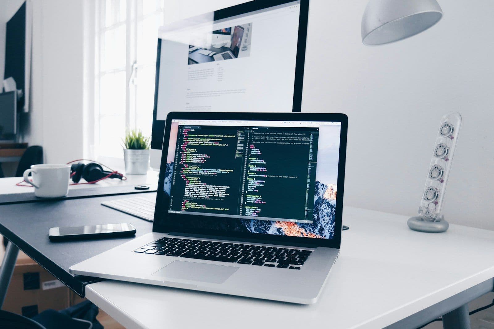 [syncsoft-auto][src:unsplash|id:1498050108023-c5249f4df085] AI coding agents writing and reviewing software on developer screens during the 2026 autonomous coding funding wave